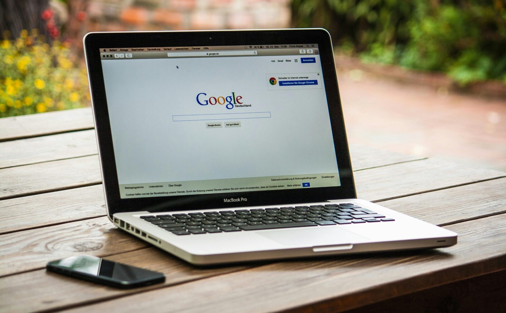 Laptop showing Google search on a desk